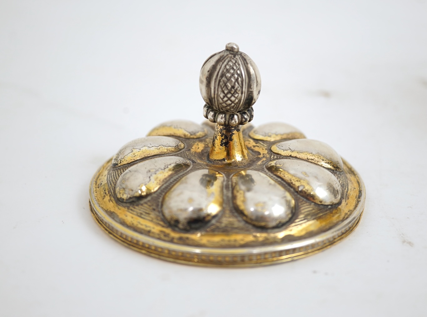 A 16th/17th century German silver gilt 'pineapple' cup and cover